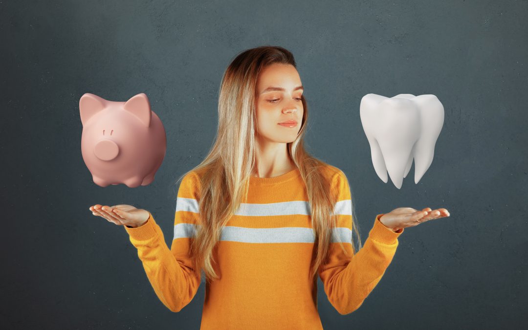 A woman with a piggy bank on one hand and a tooth on the other