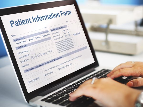 Patient Information Form on a laptop
