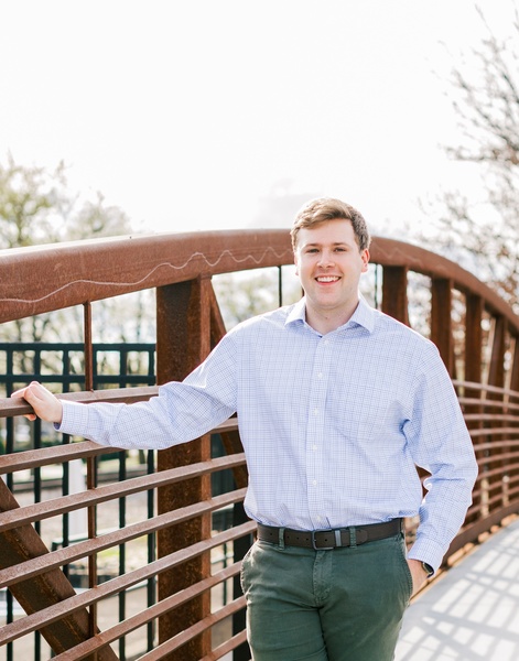 Dr. Hanigofsky leaning against a bridge in downtown Hickory, NC