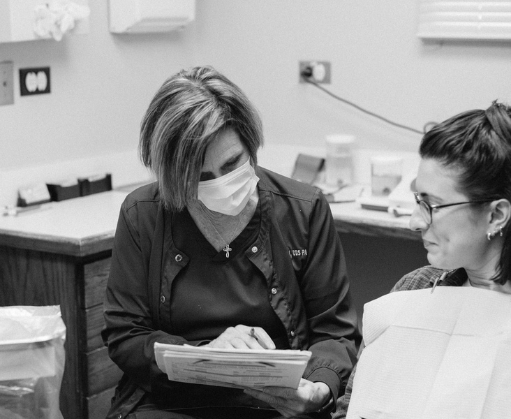 general (1) (1) Susan reviewing a chart with a patient at a hygiene appointment