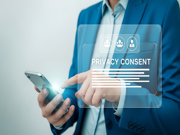 Digital privacy consent and data security concept with a person using a smartphone